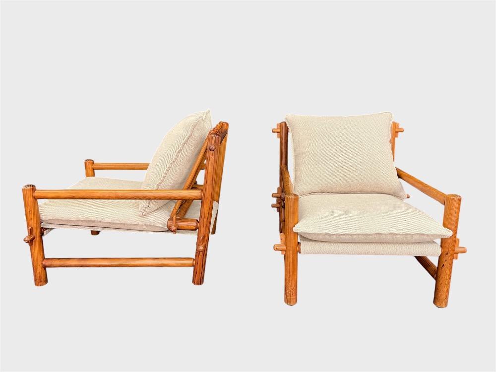 Pair of pinewood lounge chairs with ottoman. Circa 1970-80.