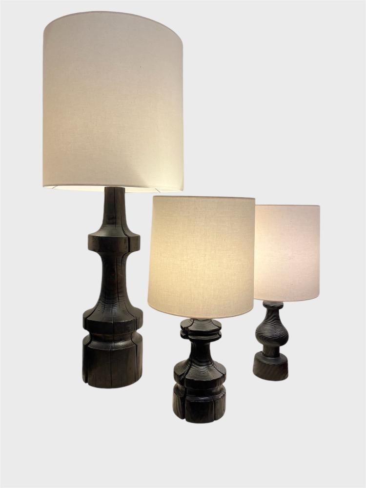 Set of 3 dark burnt pine table lamps. Circa 1970.